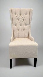 Elegant wing-backed slipper chair with sparkly buttons