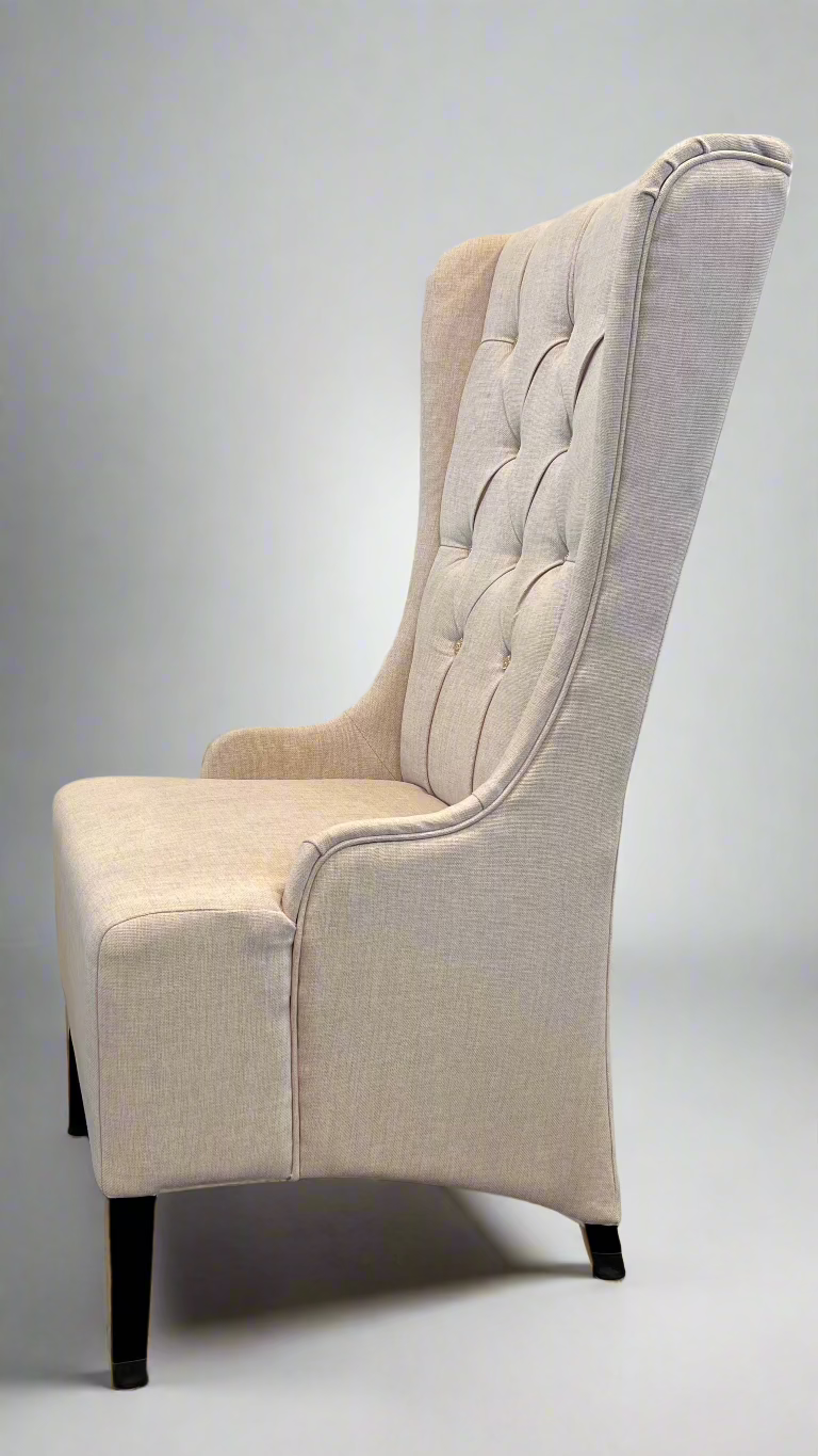 Elegant wing-backed slipper chair with sparkly buttons