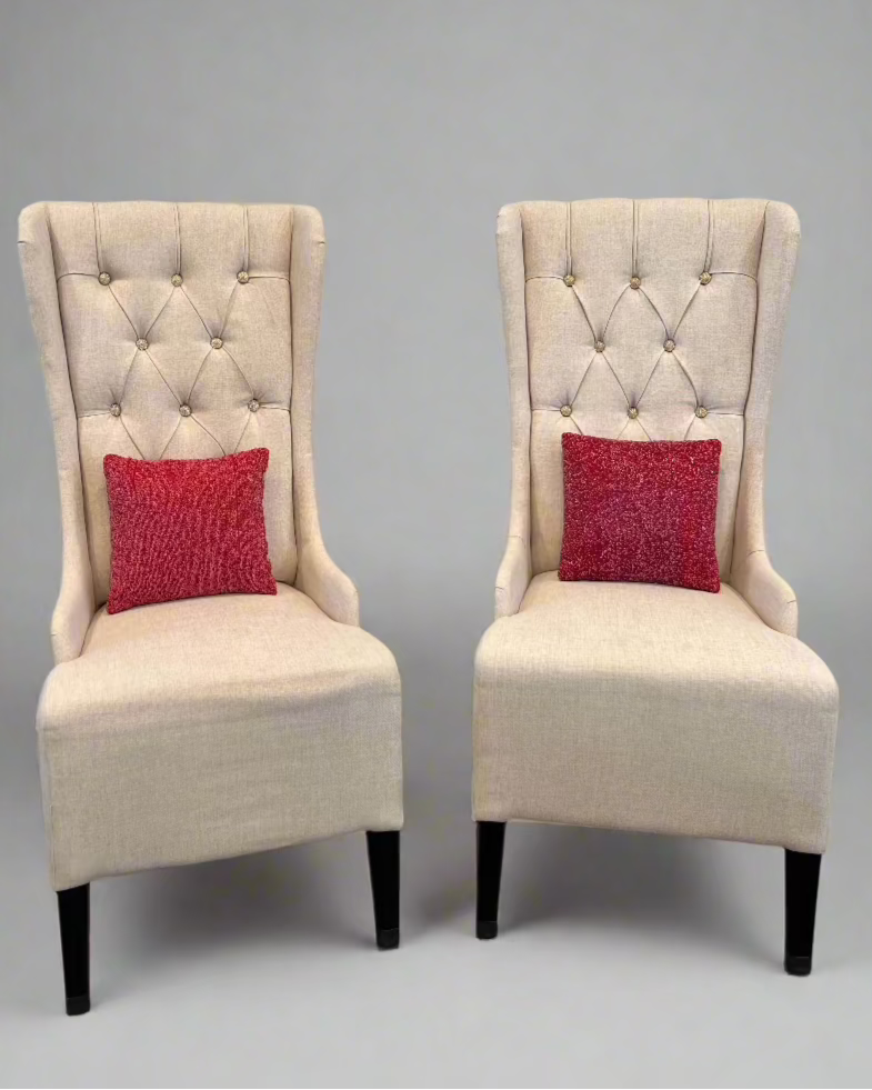 Elegant wing-backed slipper chair with sparkly buttons