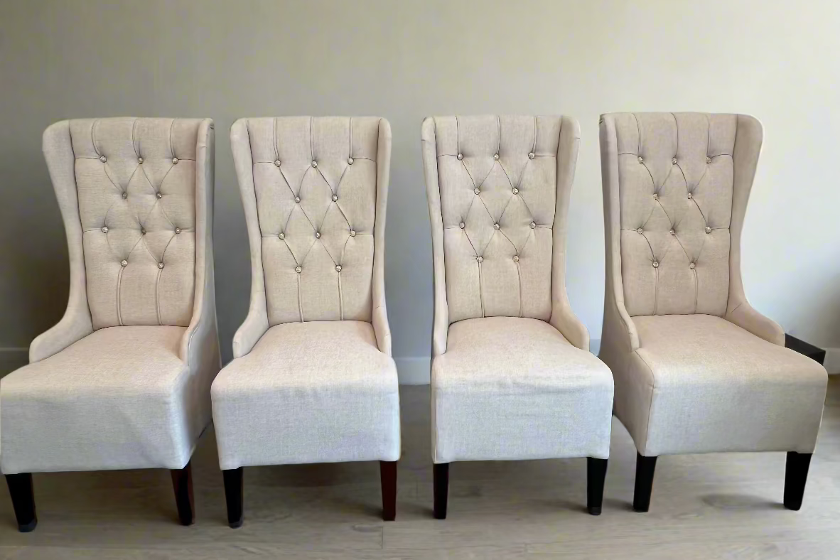 Elegant wing-backed slipper chair with sparkly buttons